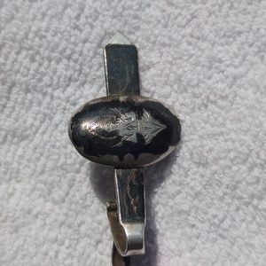 Vintage Buddhist tie pin with black enamel from Thailand